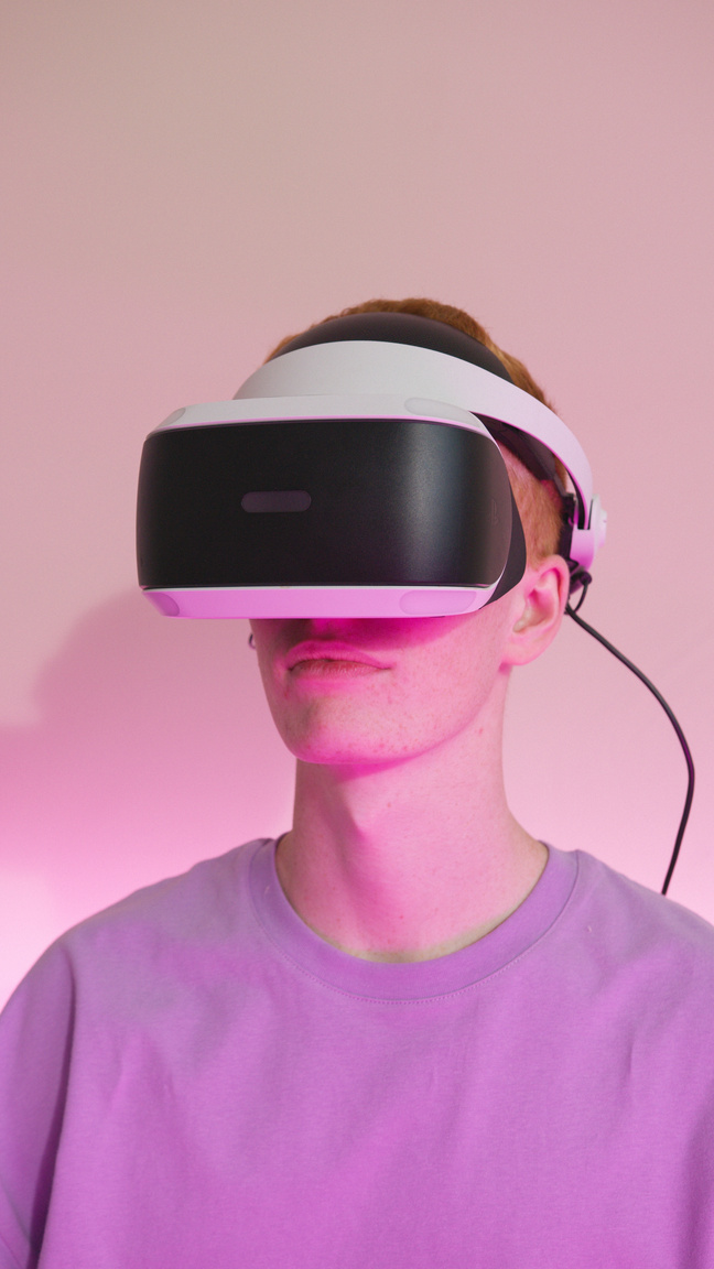 Man Wearing a Playstation Virtual Reality Headset